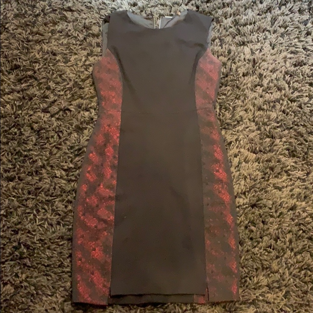 Black dress with red pattern detail